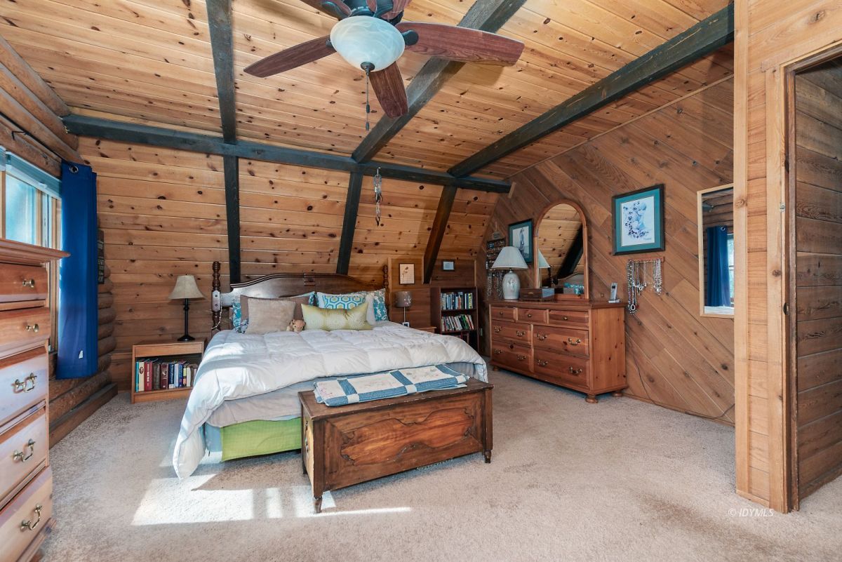 25264 Cougar Road Idyllwild, CA 92549 - Photo 25 of 40 a bed room with furniture and a large window