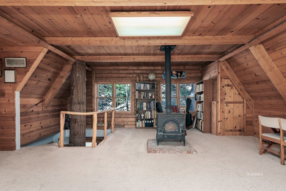25264 Cougar Road Idyllwild, CA 92549 - Photo 30 of 40 a view of living room with furniture and a chandelier
