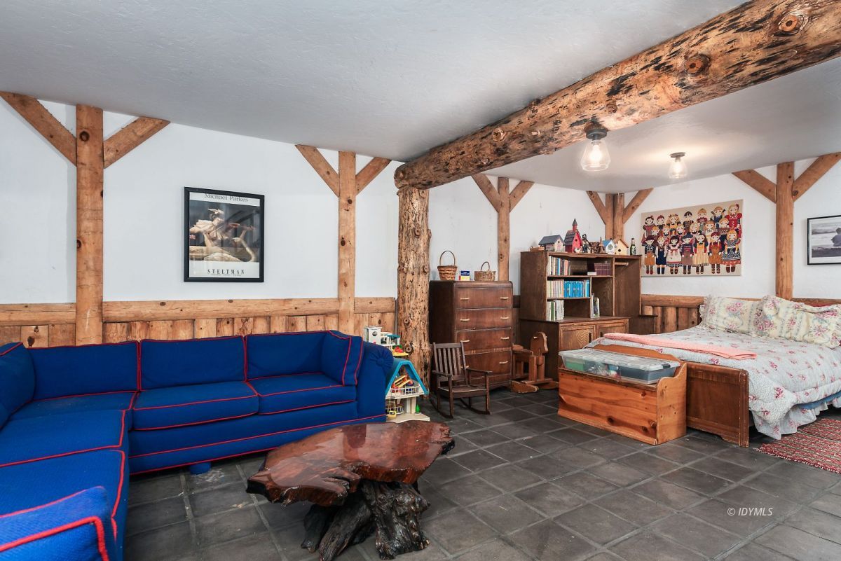 25264 Cougar Road Idyllwild, CA 92549 - Photo 33 of 40 a bedroom with furniture and a couch