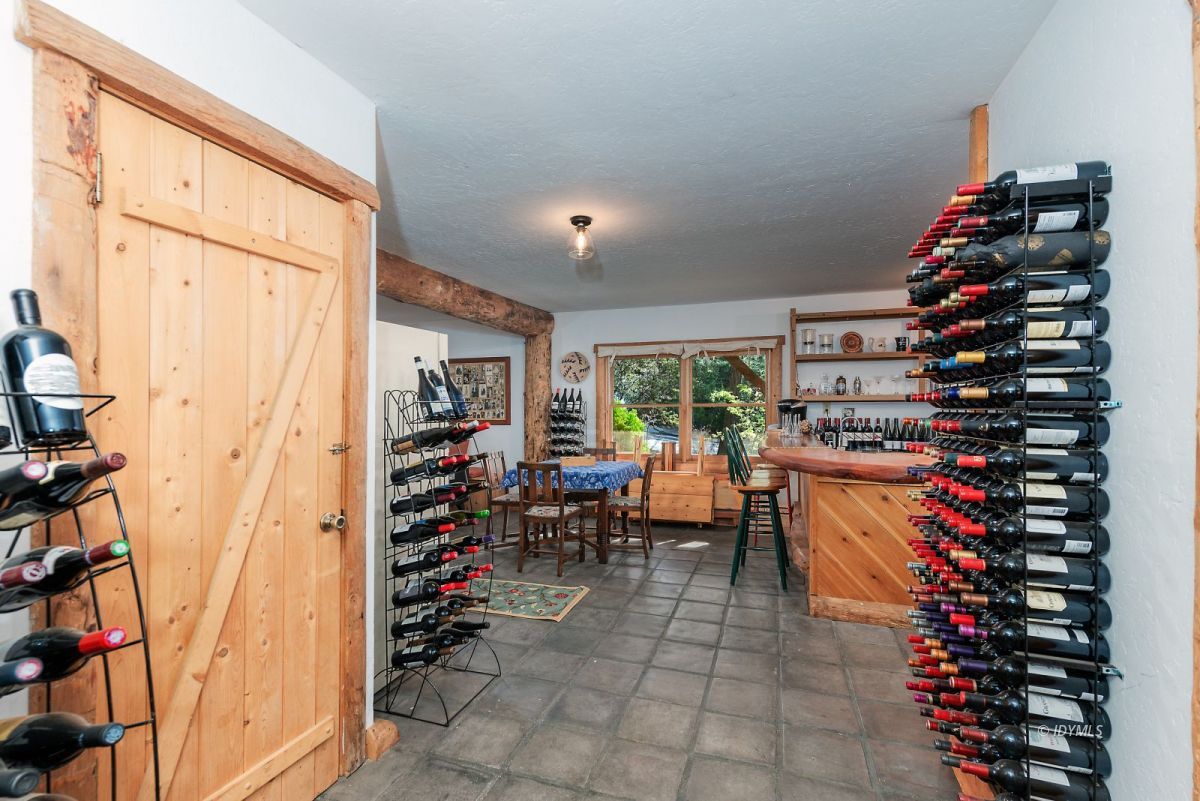 25264 Cougar Road Idyllwild, CA 92549 - Photo 35 of 40 a room with furniture and a potted plant