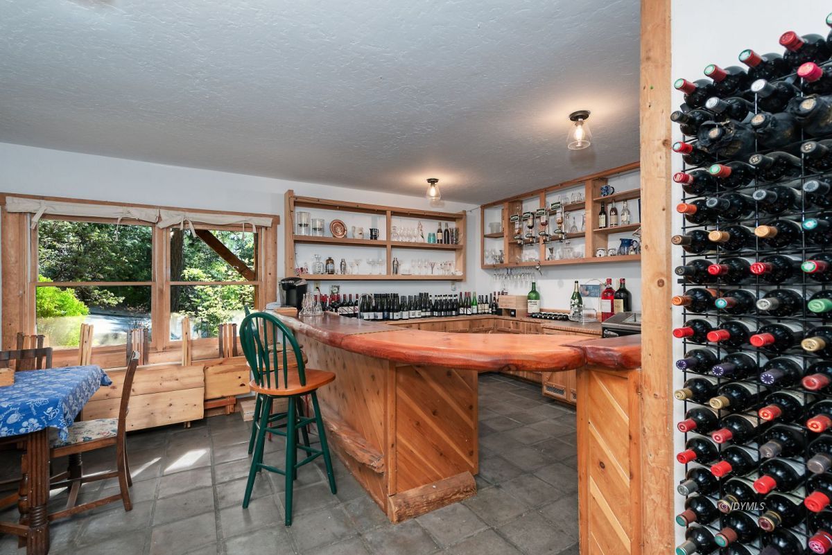 25264 Cougar Road Idyllwild, CA 92549 - Photo 36 of 40 a room with patio furniture and a large window