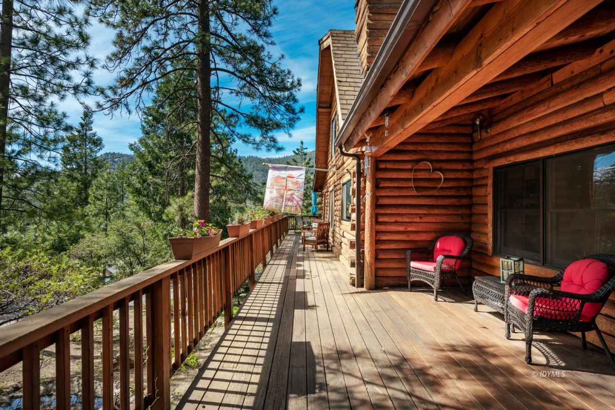 25264 Cougar Road Idyllwild, CA 92549 - Photo 6 of 40 a sitting area with furniture and wooden deck