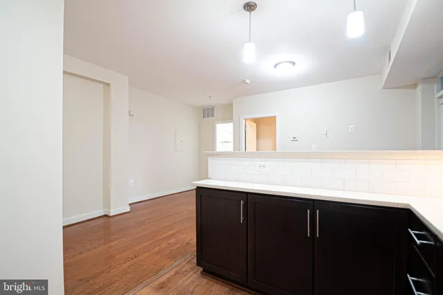 a view of room with wooden floor and window