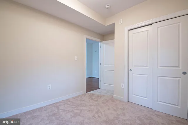 a view of an empty room and closet