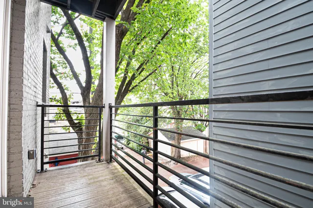 a view of porch with wooden floor