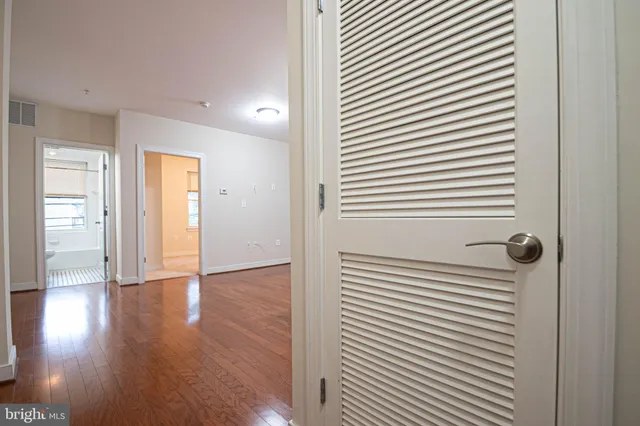 a bathroom with a sink double vanity mirror and a bathtub