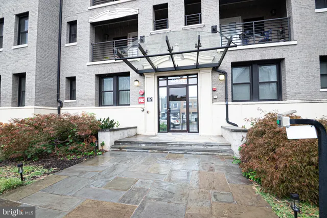a view of a building with potted plants