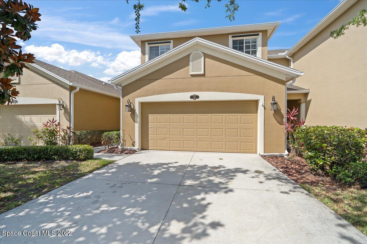 3126 Arden Circle Melbourne, FL 32934 - Photo 3 of 31 a front view of a house with a yard