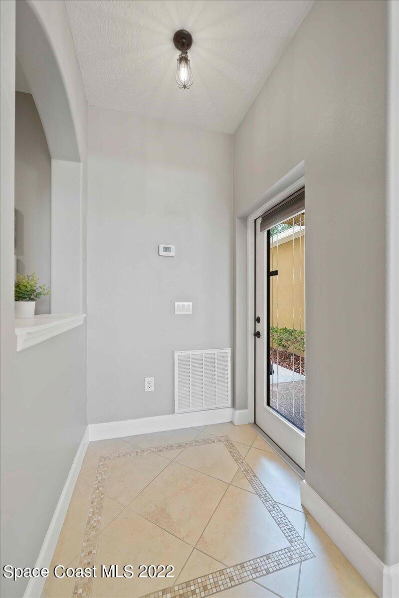 3126 Arden Circle Melbourne, FL 32934 - Photo 5 of 31 an empty room with windows and closet