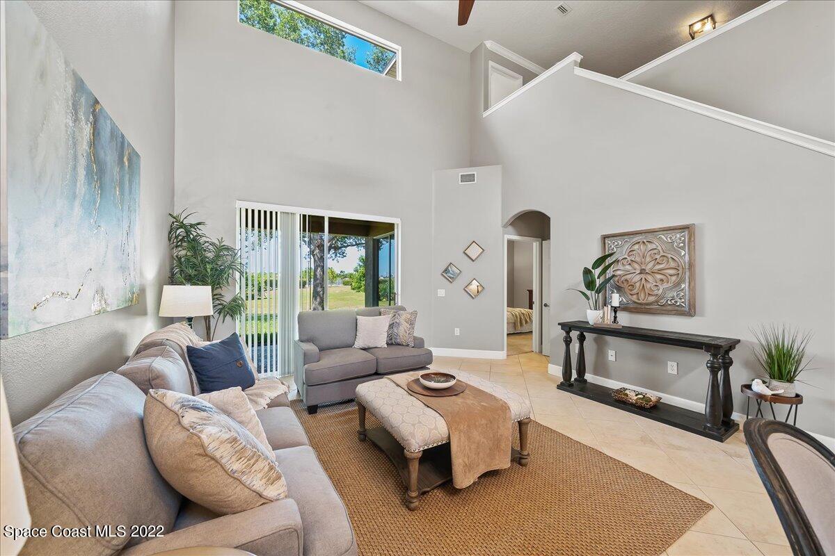 3126 Arden Circle Melbourne, FL 32934 - Photo 9 of 31 a living room with furniture and a fireplace