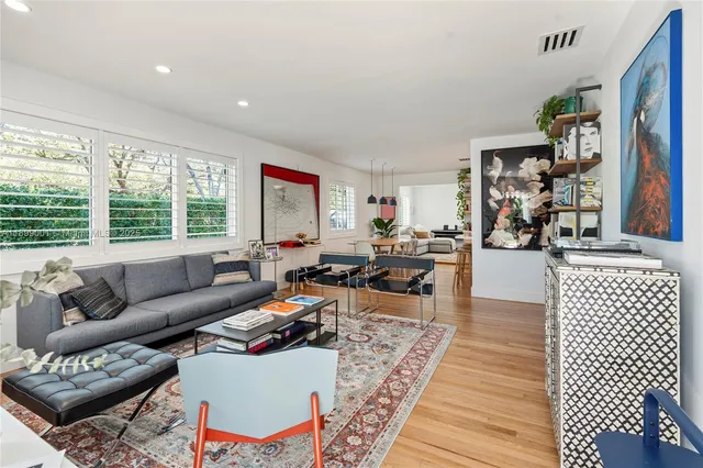 a living room with furniture and a table
