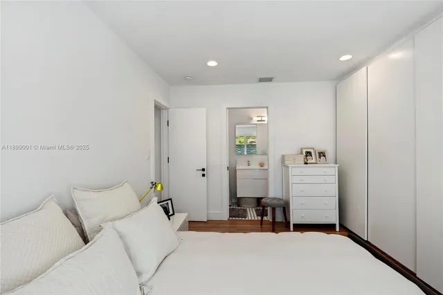 a bed room with furniture and window