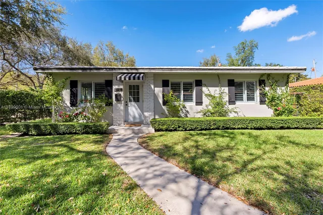 front view of a house with a yard