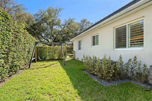 a view of a backyard of the house