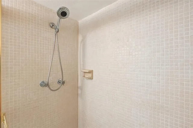 a room with pool table and windows