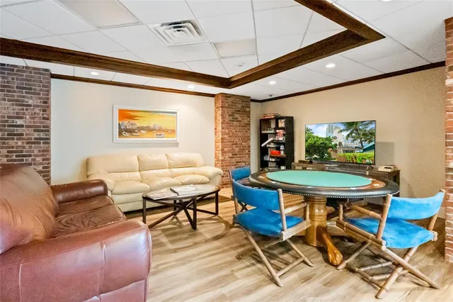 a front view of a house with garden and tree