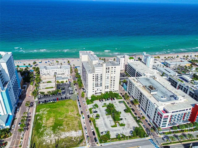 a view of a hallway with wooden shelves