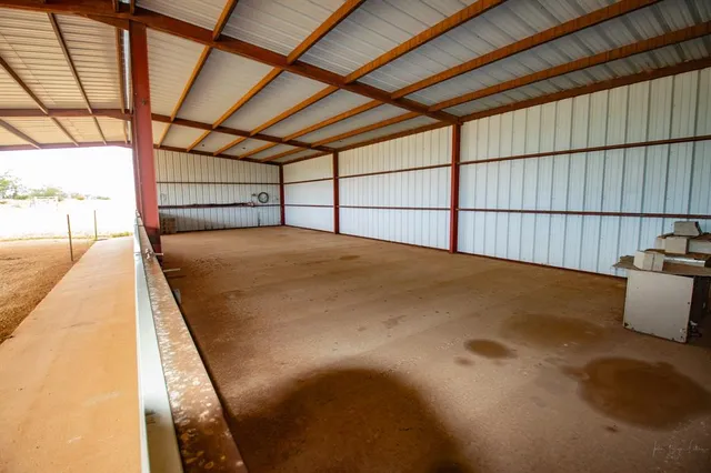 an aerial view of a houses with beach