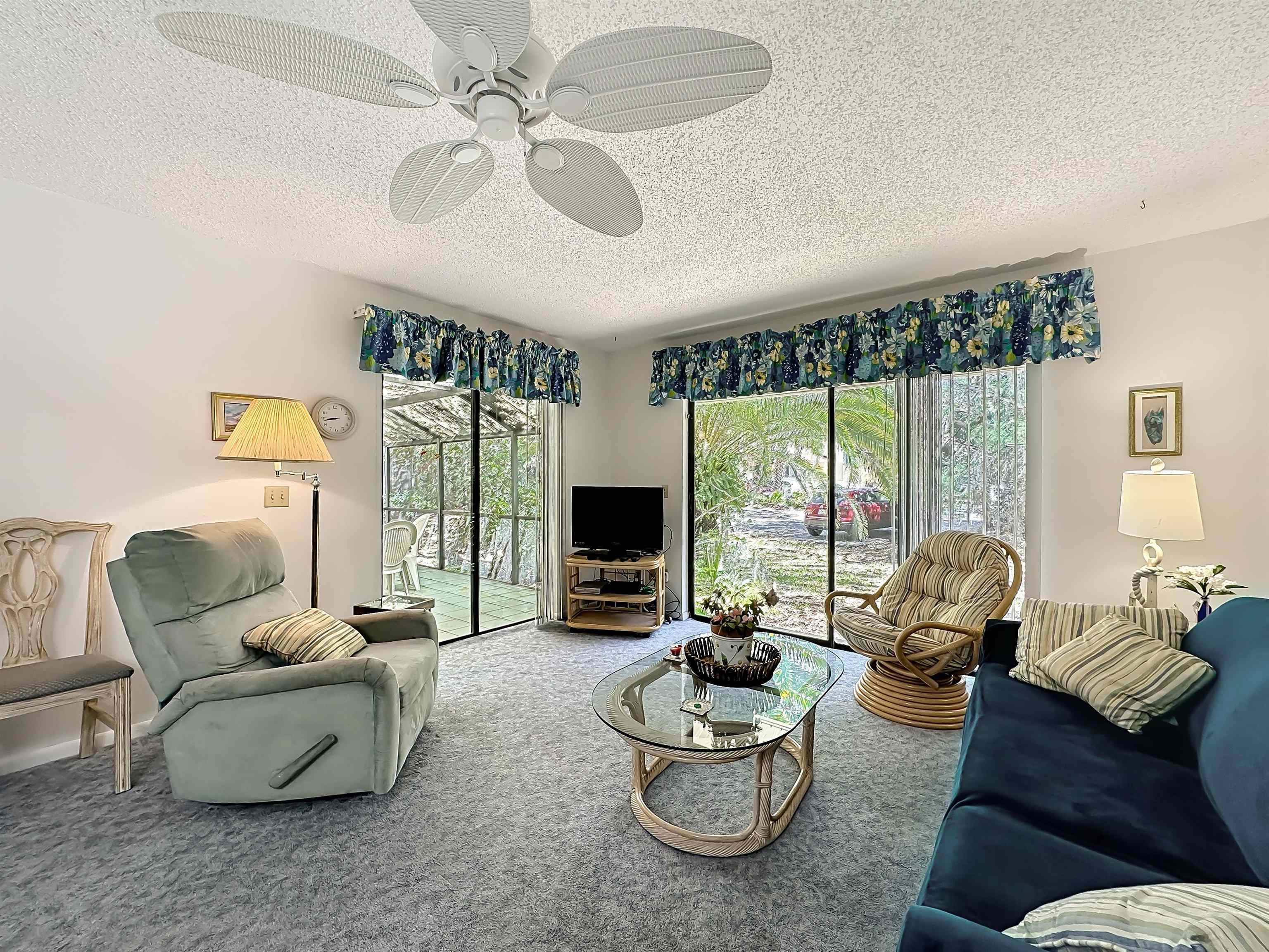 3960 A1A South, Unit 914 St. Augustine, FL 32080 - Photo 11 of 19 a living room with furniture and a large window