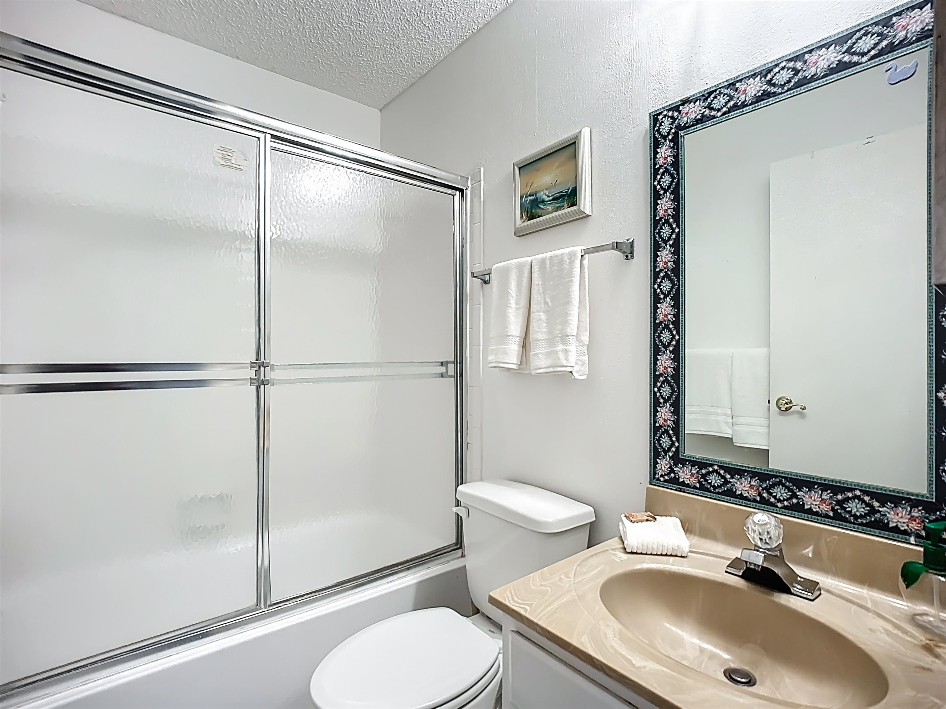 3960 A1A South, Unit 914 St. Augustine, FL 32080 - Photo 17 of 19 a bathroom with a sink toilet and shower