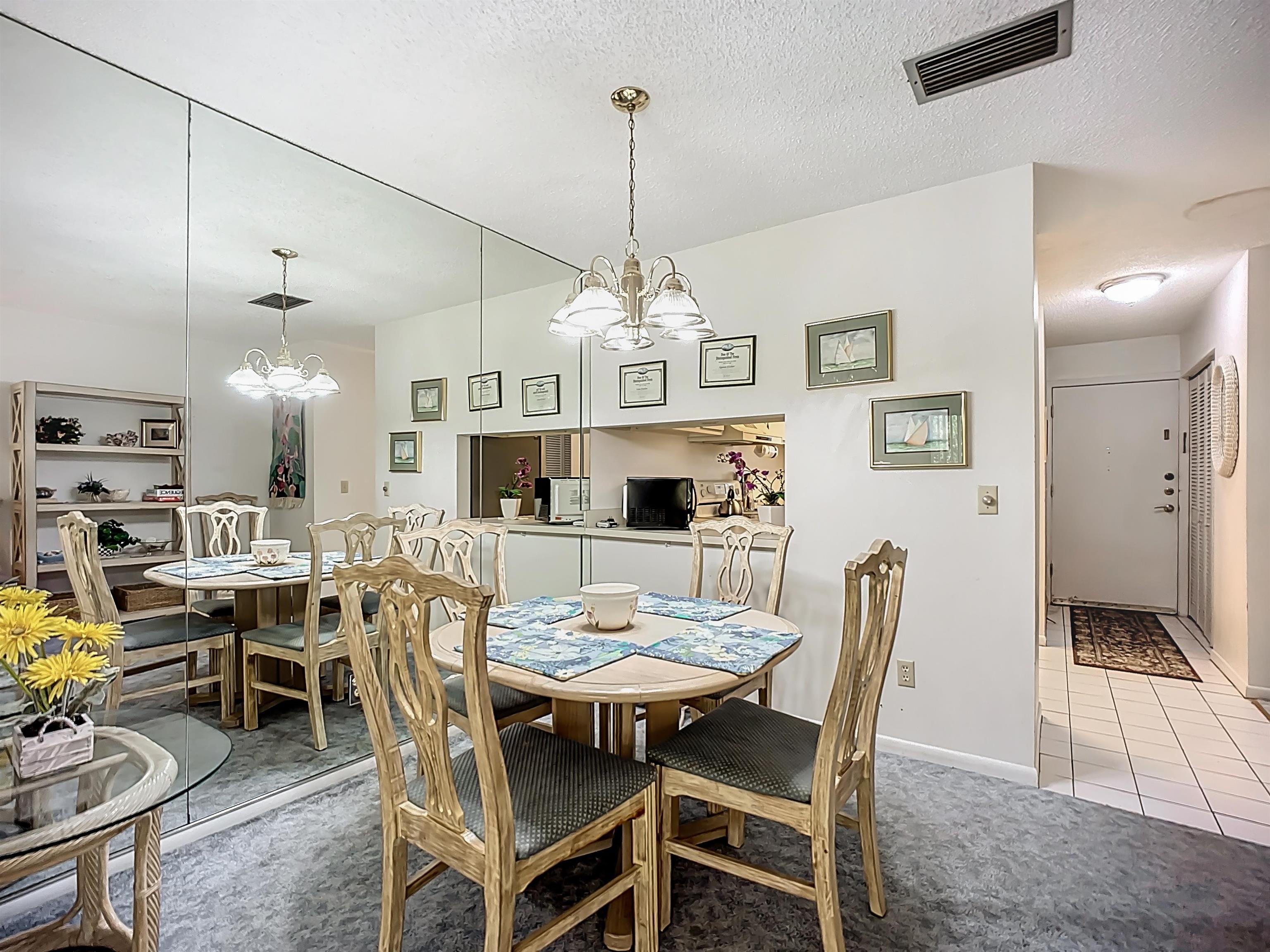 3960 A1A South, Unit 914 St. Augustine, FL 32080 - Photo 10 of 19 a view of a dining room with furniture
