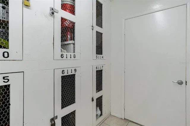 a view of a swimming pool with outdoor seating and plants