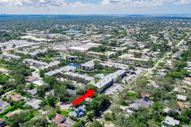 a sign broad in front of flowers