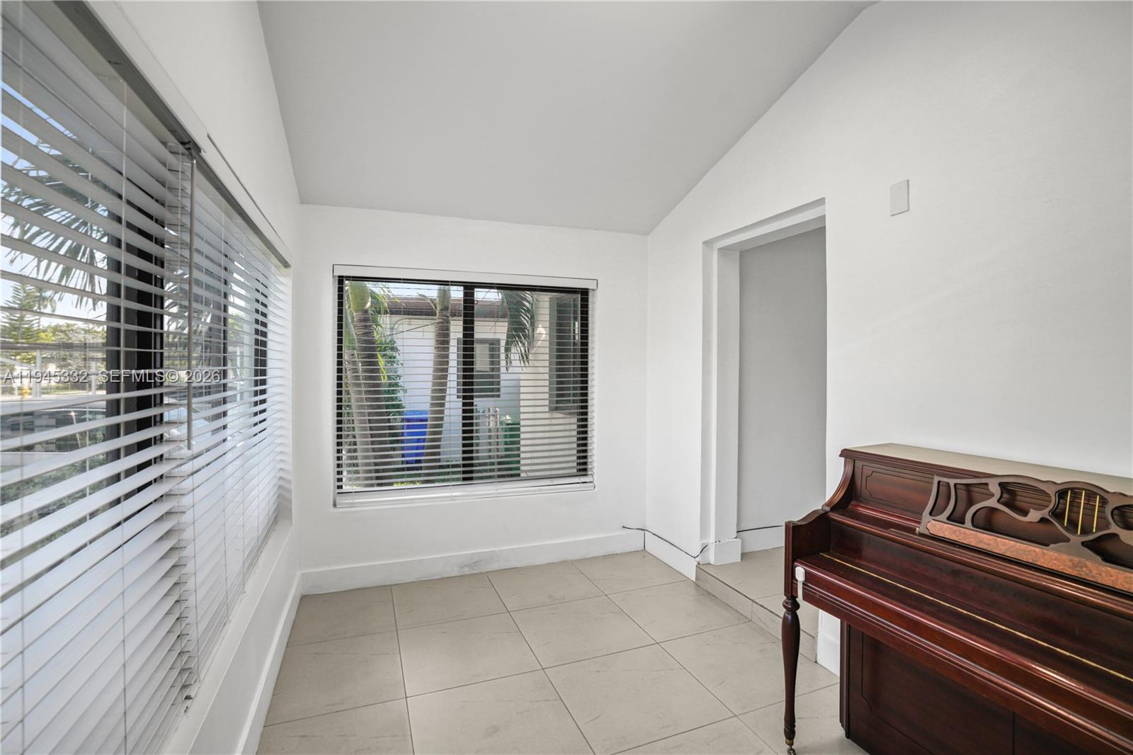 2290 Southwest 2nd Terrace Miami, FL 33135 - Photo 14 of 60 a view of an empty room with glass door
