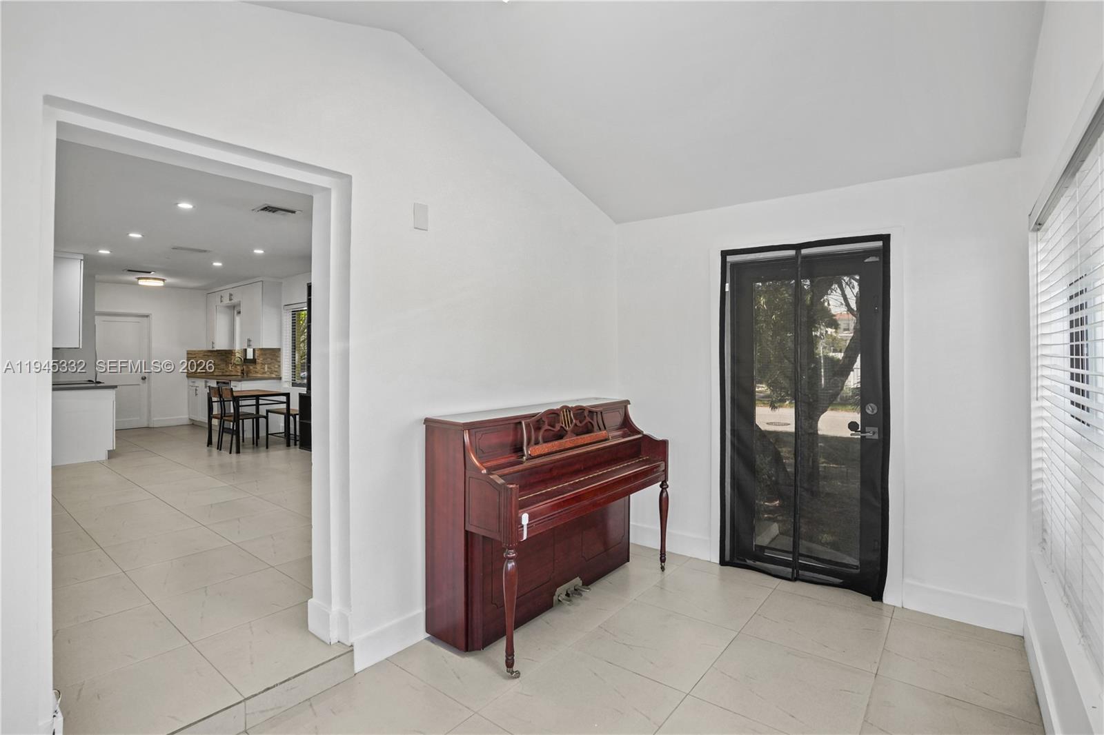 2290 Southwest 2nd Terrace Miami, FL 33135 - Photo 15 of 60 a living room with furniture and a piano
