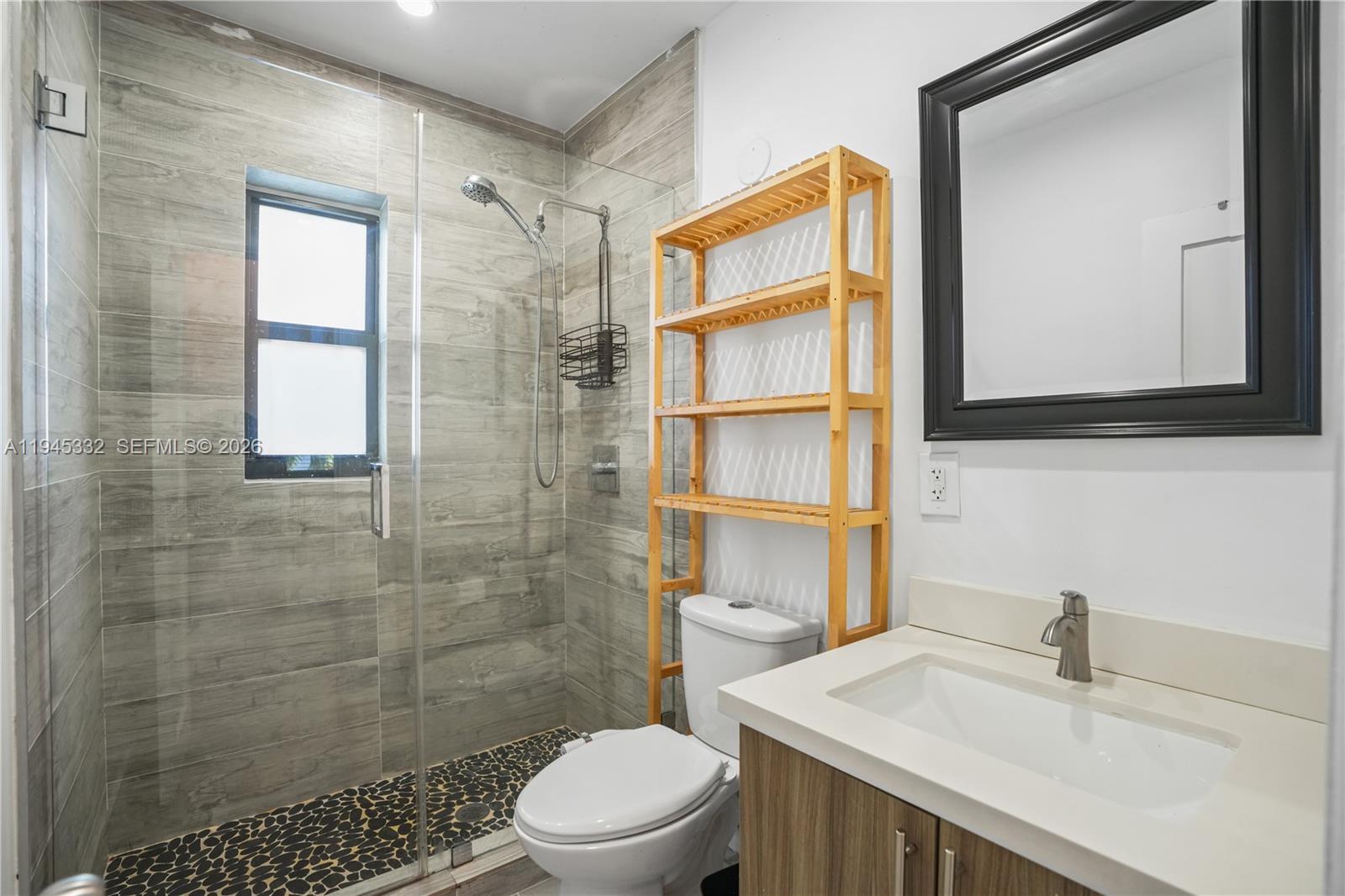 2290 Southwest 2nd Terrace Miami, FL 33135 - Photo 17 of 60 a bathroom with a sink a toilet and shower