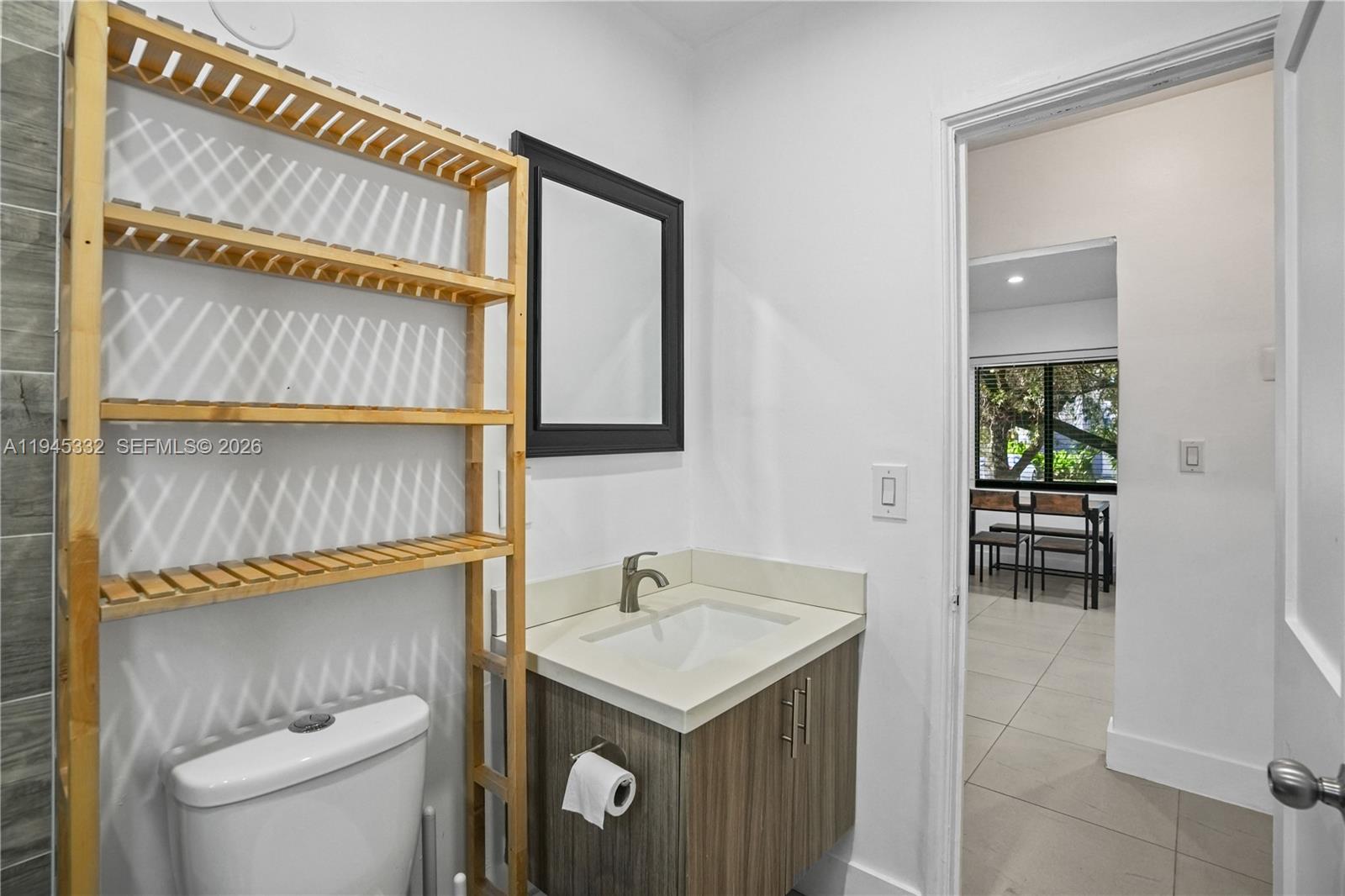 2290 Southwest 2nd Terrace Miami, FL 33135 - Photo 18 of 60 a bathroom with a sink a toilet and a mirror