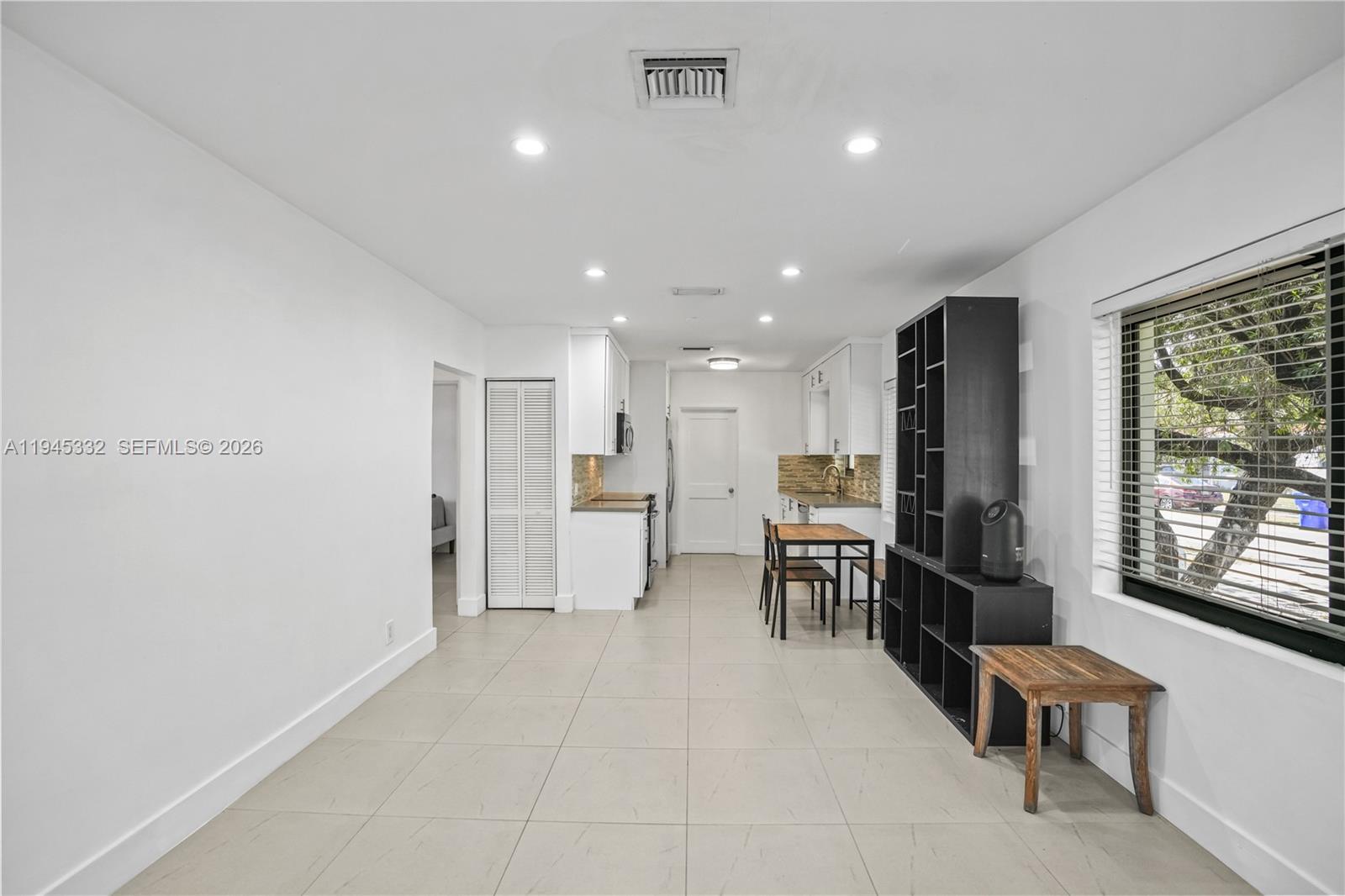2290 Southwest 2nd Terrace Miami, FL 33135 - Photo 2 of 60 a living room with furniture a large window and chairs
