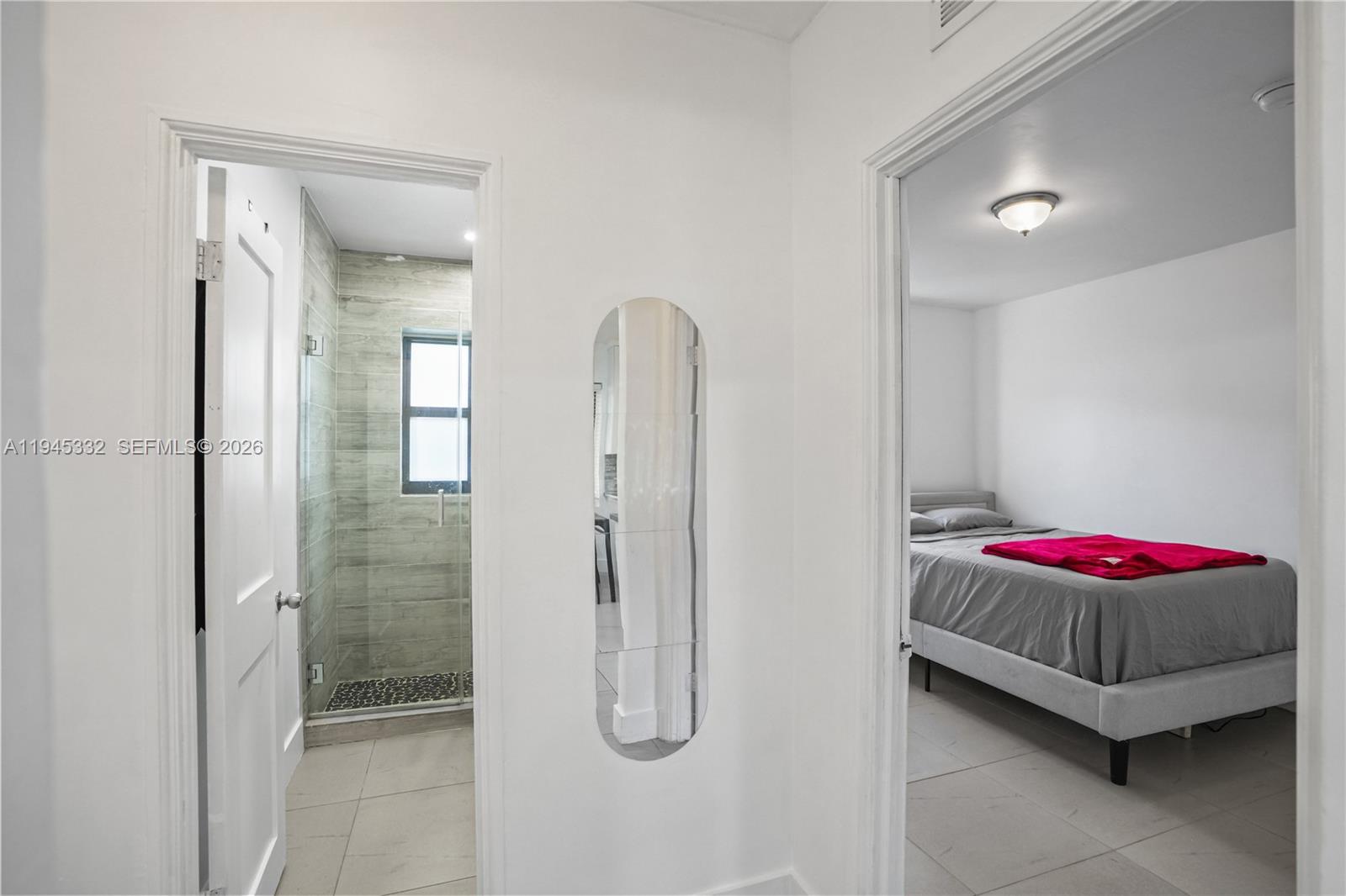 2290 Southwest 2nd Terrace Miami, FL 33135 - Photo 23 of 60 a bathroom with a granite countertop shower sink and mirror