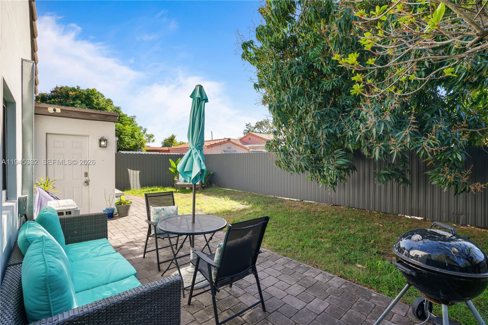 2290 Southwest 2nd Terrace Miami, FL 33135 - Photo 27 of 60 a view of a backyard with furniture and a slide