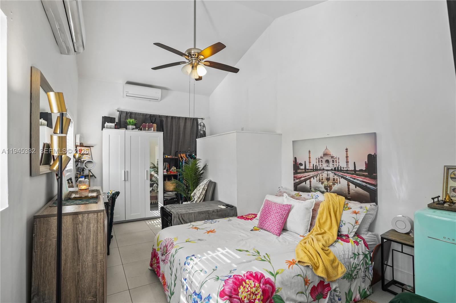 2290 Southwest 2nd Terrace Miami, FL 33135 - Photo 33 of 60 a bedroom with a bed and a chandelier