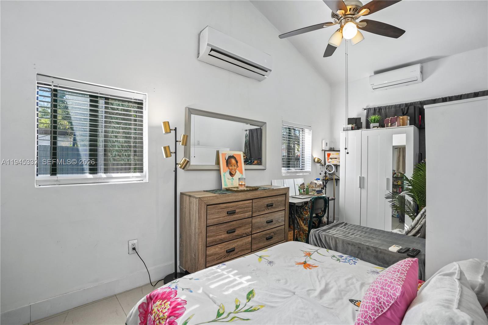 2290 Southwest 2nd Terrace Miami, FL 33135 - Photo 34 of 60 a bed room with a bed window and a chandelier