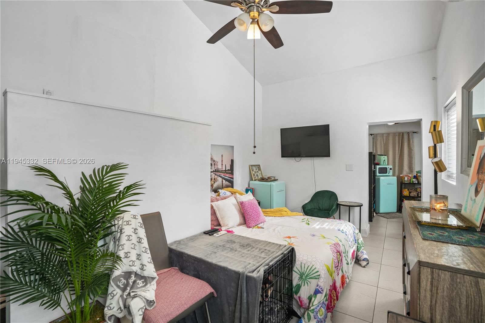 2290 Southwest 2nd Terrace Miami, FL 33135 - Photo 35 of 60 a bedroom with a large bed and a flat tv screen