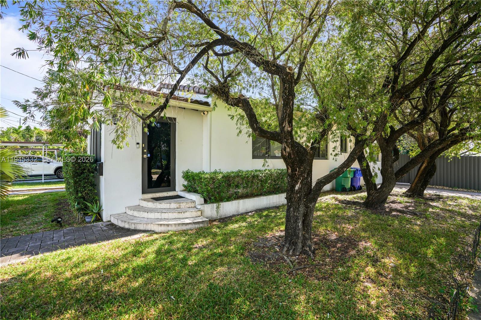 2290 Southwest 2nd Terrace Miami, FL 33135 - Photo 38 of 60 a tree in the middle of a yard