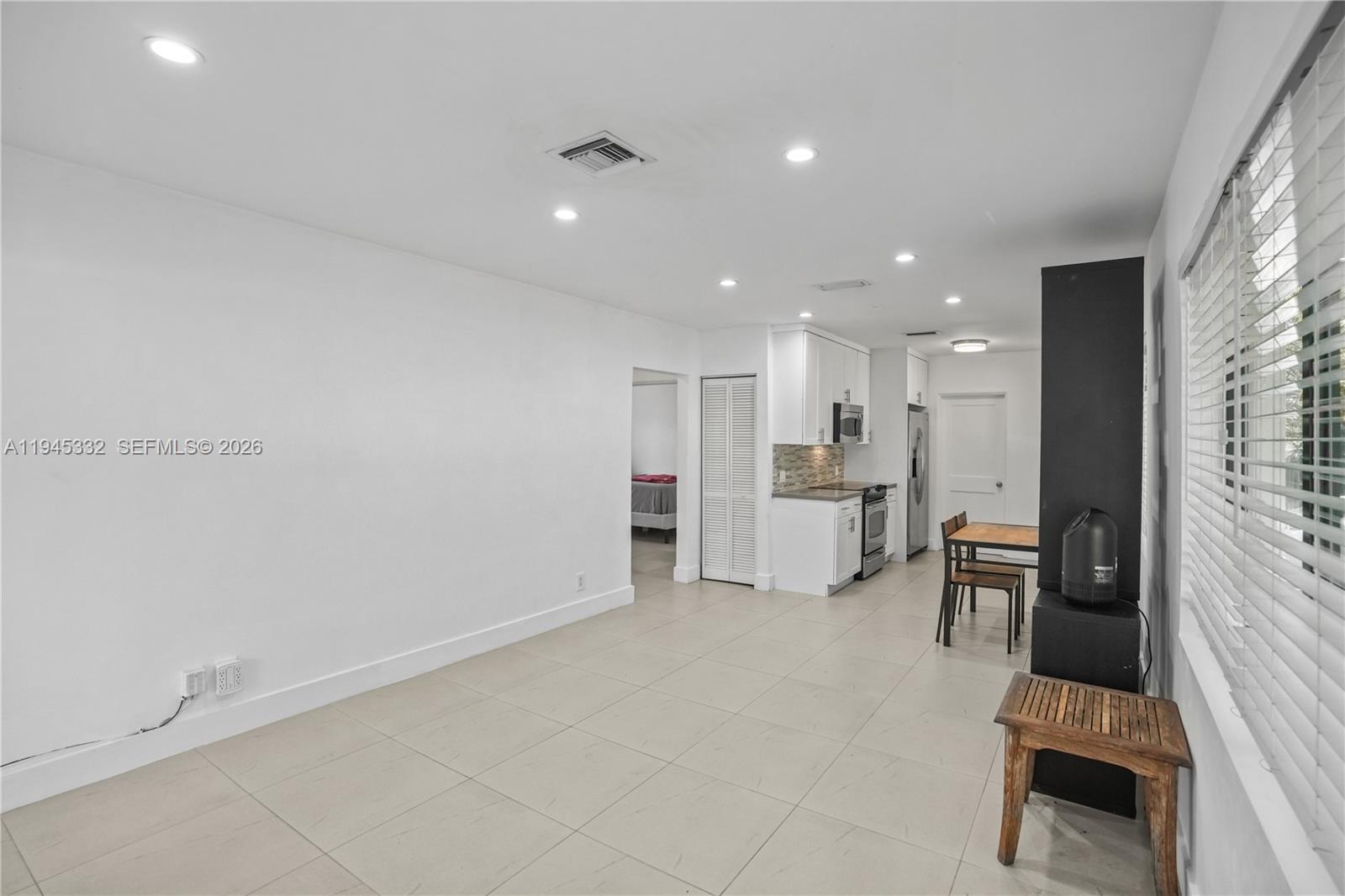 2290 Southwest 2nd Terrace Miami, FL 33135 - Photo 4 of 60 a view of kitchen with refrigerator stove and white cabinets