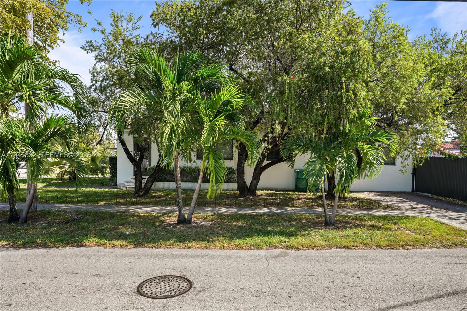 2290 Southwest 2nd Terrace Miami, FL 33135 - Photo 42 of 60 a view of a tree in front of a house