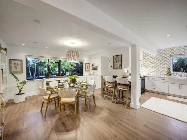 a bathroom with double vanity sinks and a mirror