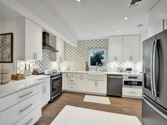 a bathroom with a sink a toilet and a shower