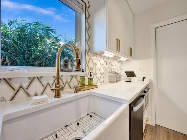 a living room with a couch and wooden floor