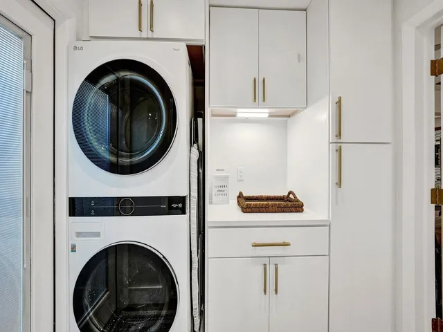 a bedroom with a large bed and a large window