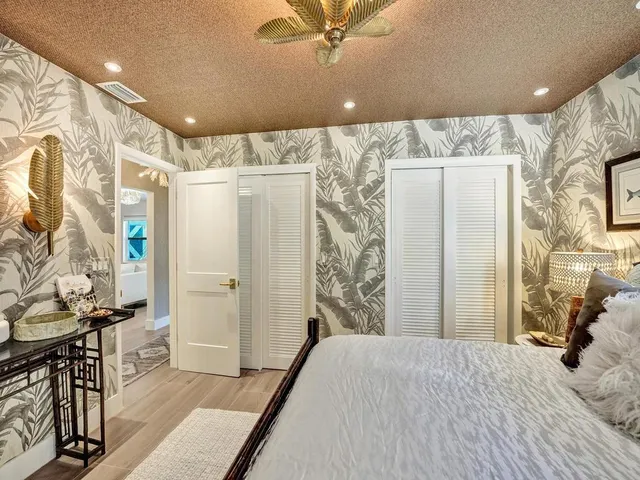 a view of a house with backyard porch and sitting area