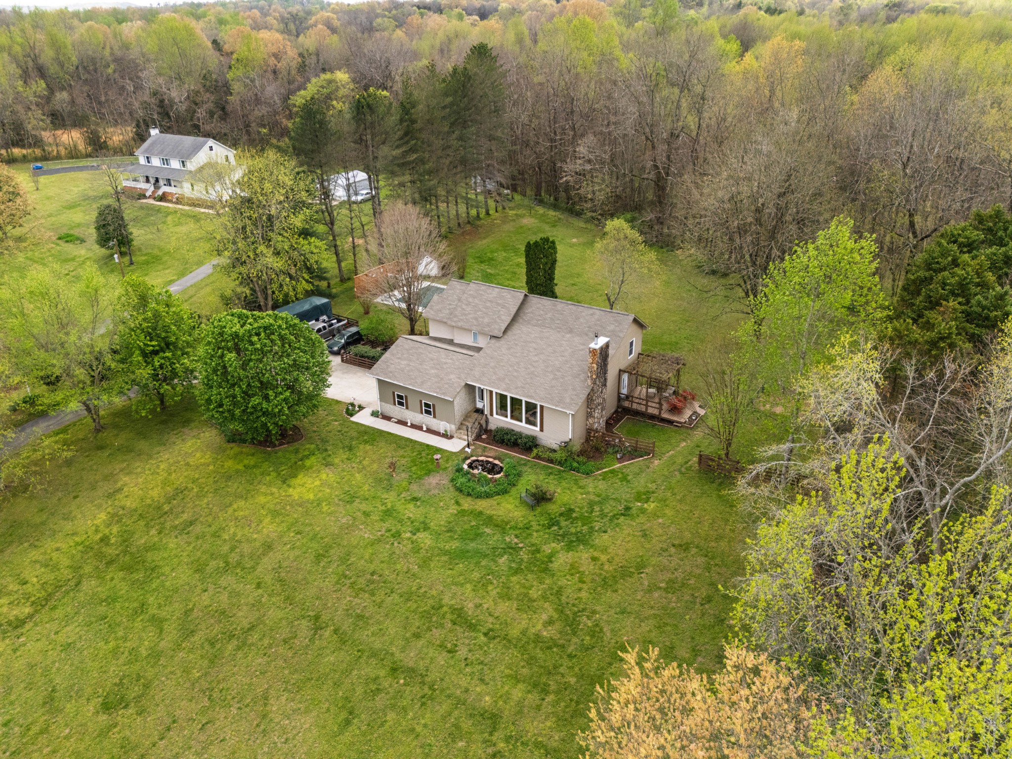 an aerial view of a house with garden space and street view