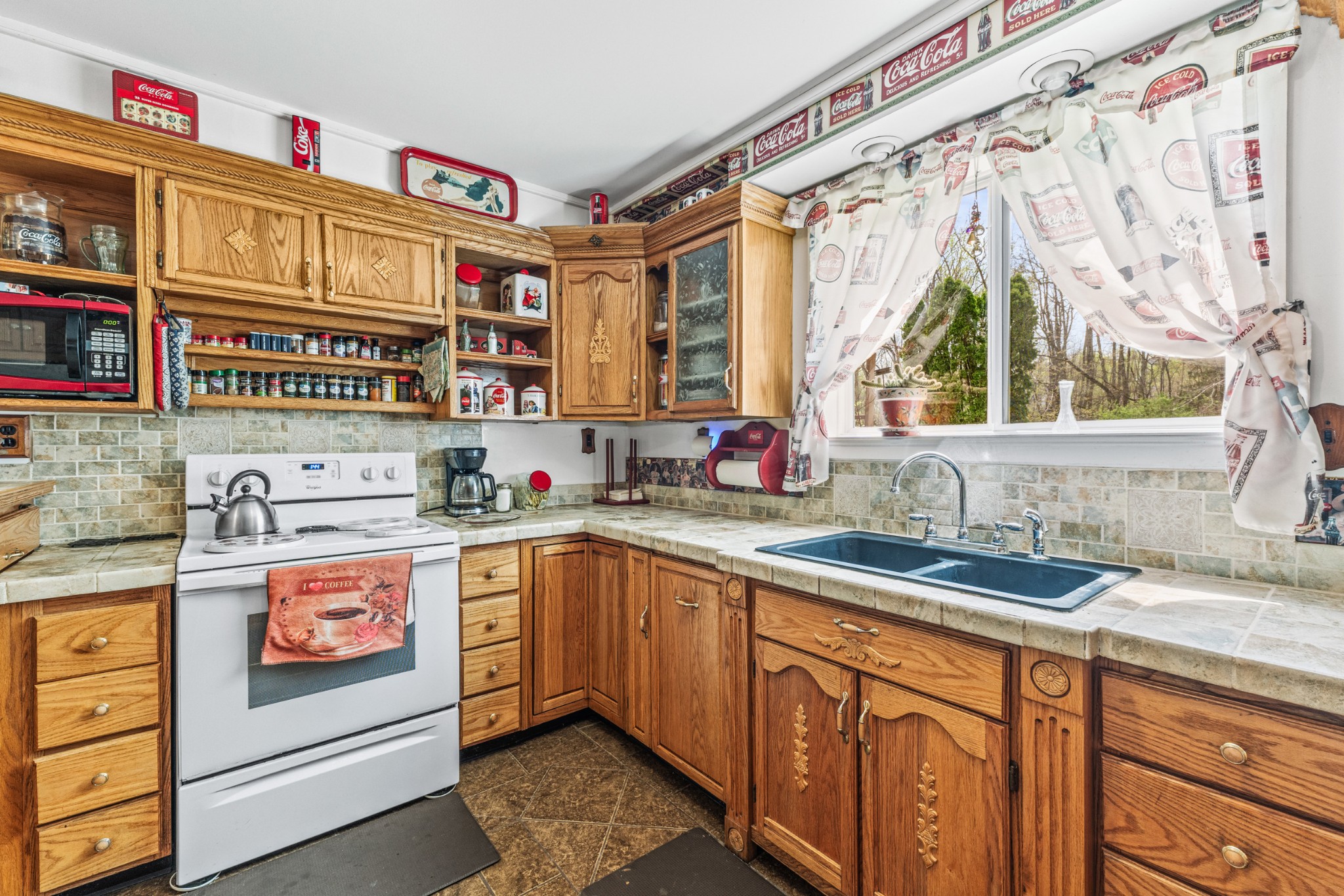 300 Wright Road Prospect, TN 38477 - Photo 32 of 65 a kitchen with stainless steel appliances a sink and a window