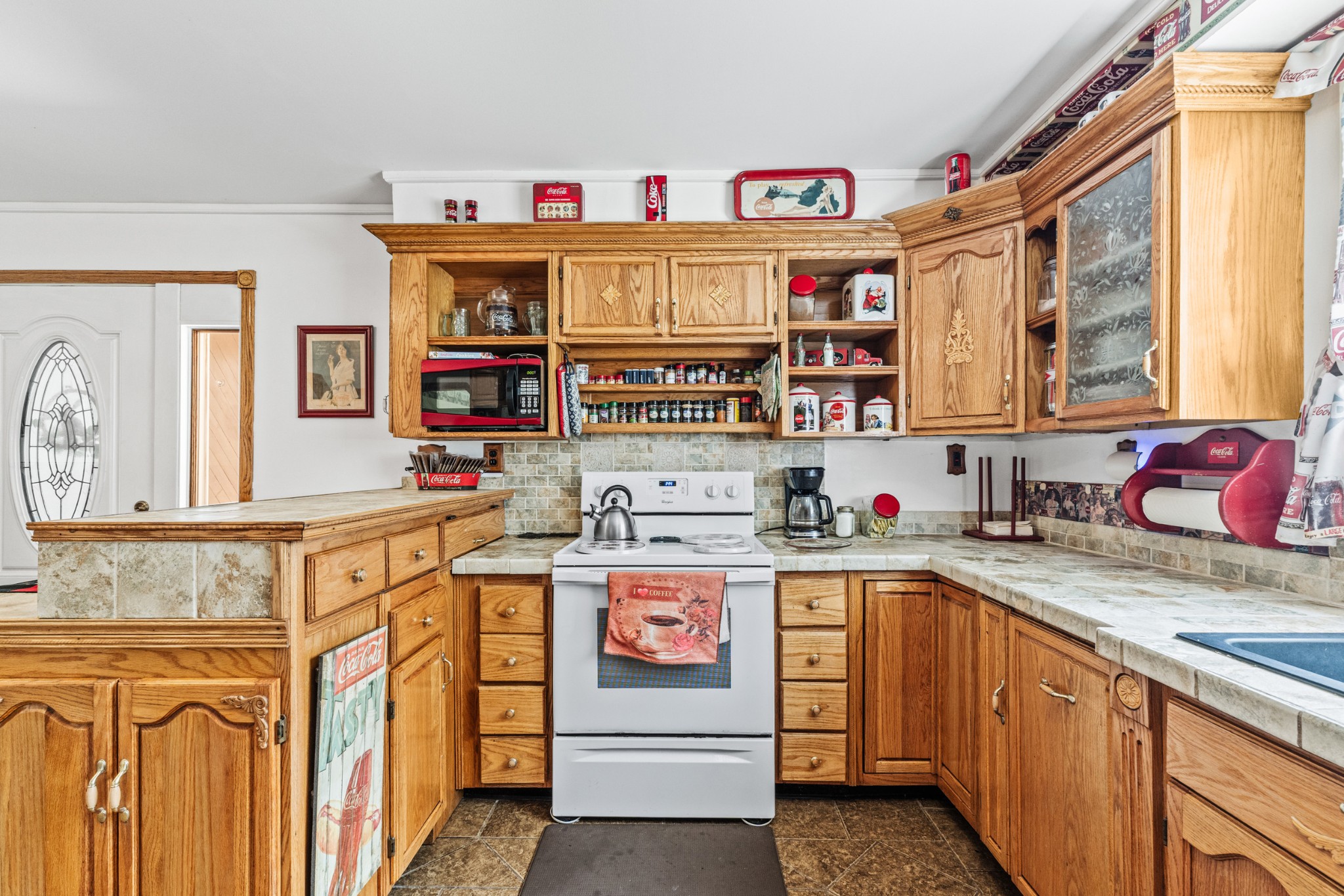 300 Wright Road Prospect, TN 38477 - Photo 33 of 65 a kitchen with granite countertop lots of clutter and stainless steel appliances
