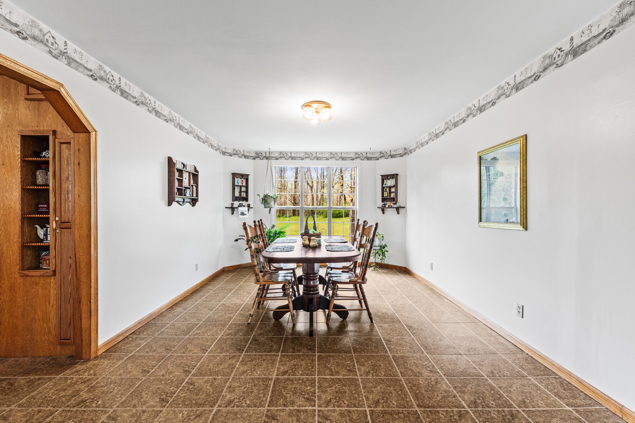 300 Wright Road Prospect, TN 38477 - Photo 35 of 65 a dining room with furniture and a table and potted plants