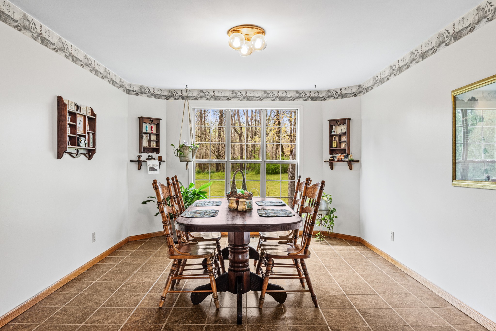300 Wright Road Prospect, TN 38477 - Photo 37 of 65 a dining room with furniture a rug and a chandelier